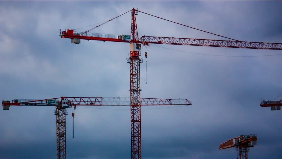 Construction site with building materials and crane